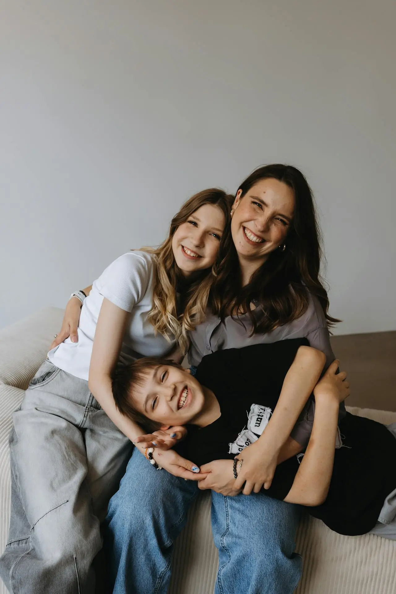 Happy family with mother and two children smiling together